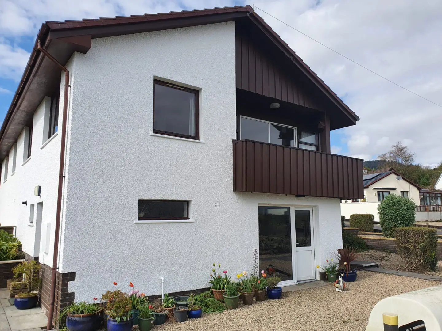 white and dark brown house